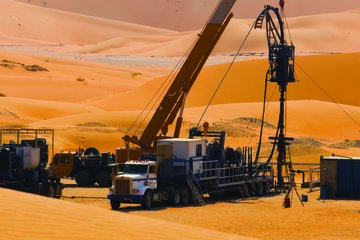 Photo of a rig site in the desert.
